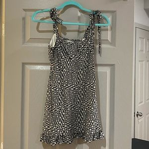 black and white mini dress with bow tie straps